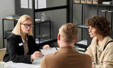 Female insurance broker consulting couple